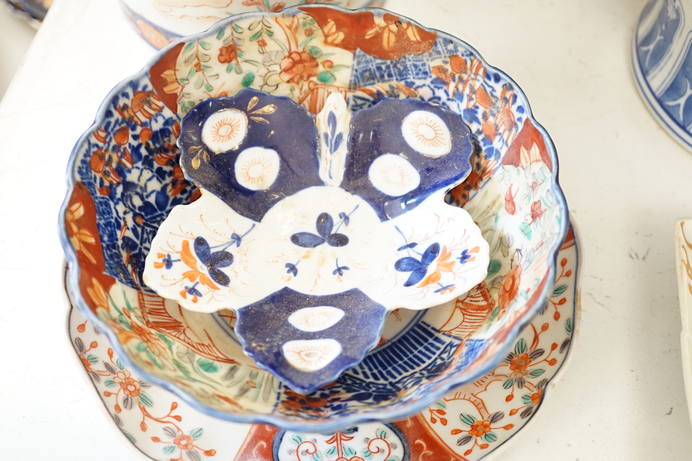 A Japanese Imari vase, a Chinese blue and white vase, two dishes, a bowl and a set of five dishes (10)